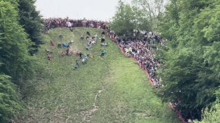  Viral video shows cheese-rolling competition as participants tumble downhill - Fox News